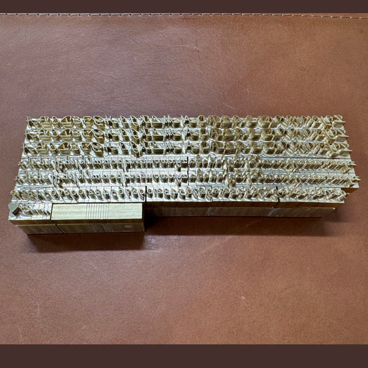 Custom brass alphabet stamp set in Park Avenue font